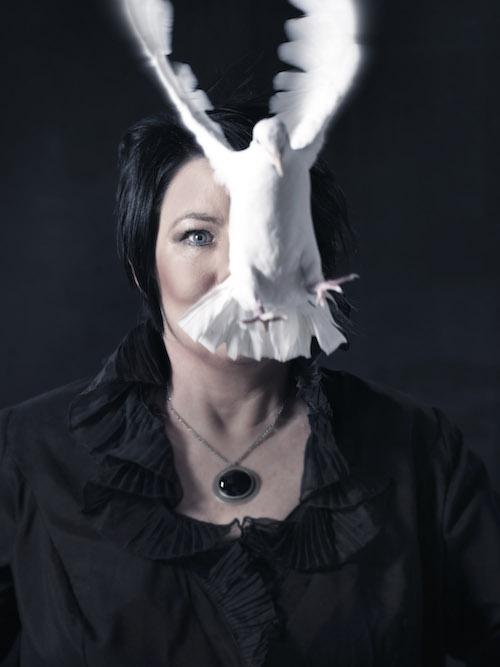 CathJ amison promo pic with white dove